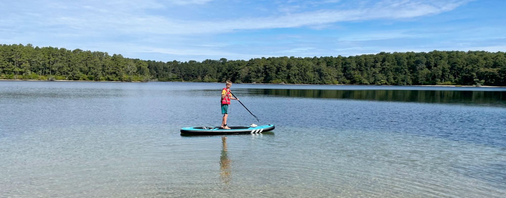 Standup paddle boarding is a great way to explore Cape Cod's many kettle ponds.