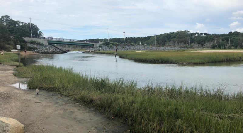 The entrance to Muddy Creek under the Route 28 Bridge as seen from the parking lot at Jackknife Beach in Chatham.